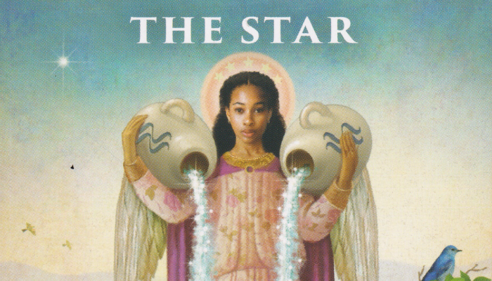 Cropped image of A Tarot card with the Star of a woman carrying two jugs with sparkly things flowing out of it