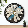 Decorative wall clock with a floral design on a white background