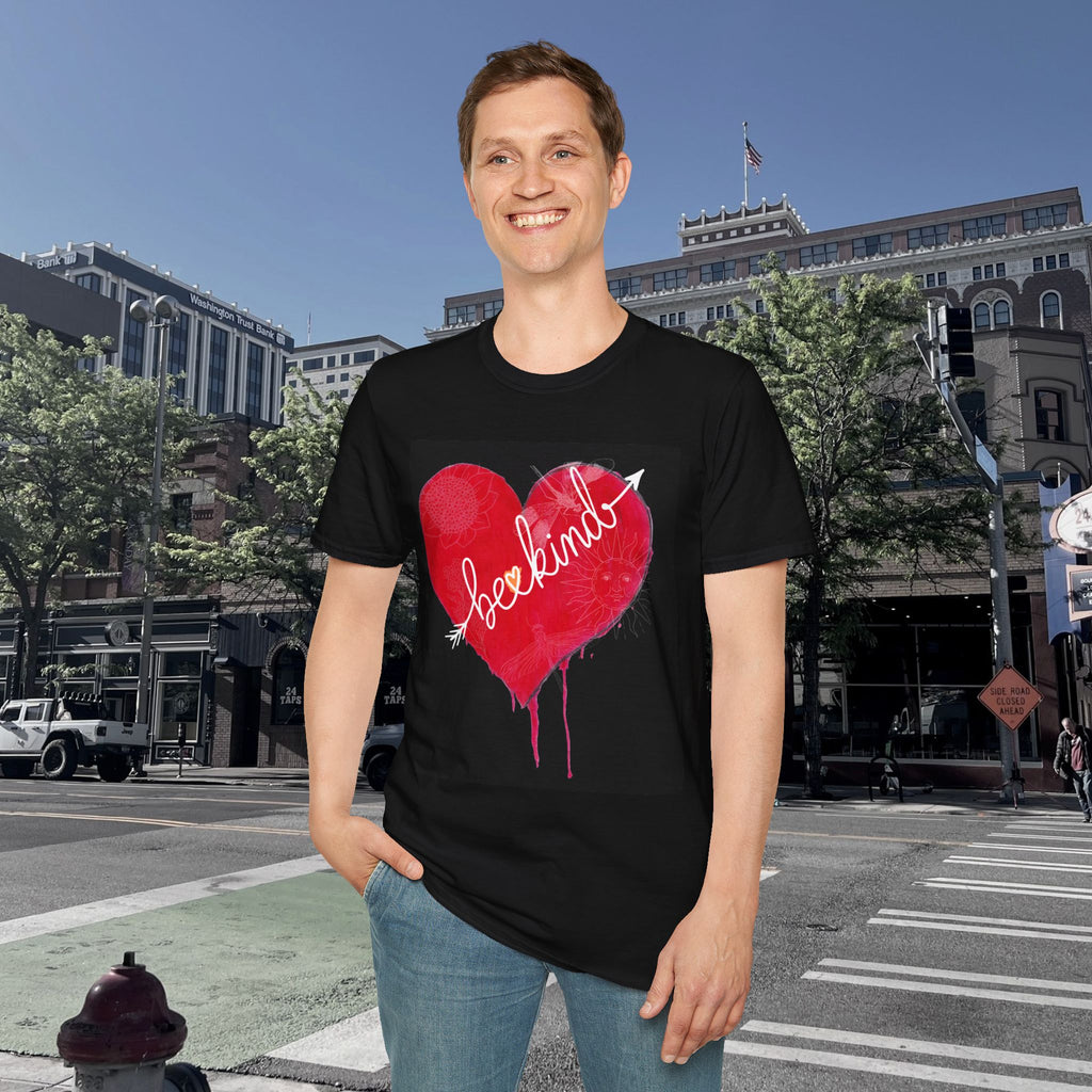 Person wearing a black t-shirt with a red heart graphic and 'beekin' text on a city street background