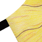 Close-up of a yellow fabric with brown lines and a black strap on a white background