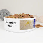 White ceramic pet bowl with pet food and customizable label on a white background