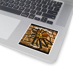 Laptop with a spider-themed sticker on the palm rest area