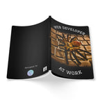 Book with a spider illustration and text on a white background