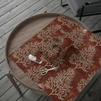 Wooden tray with a decorative red and beige pattern on a wooden surface