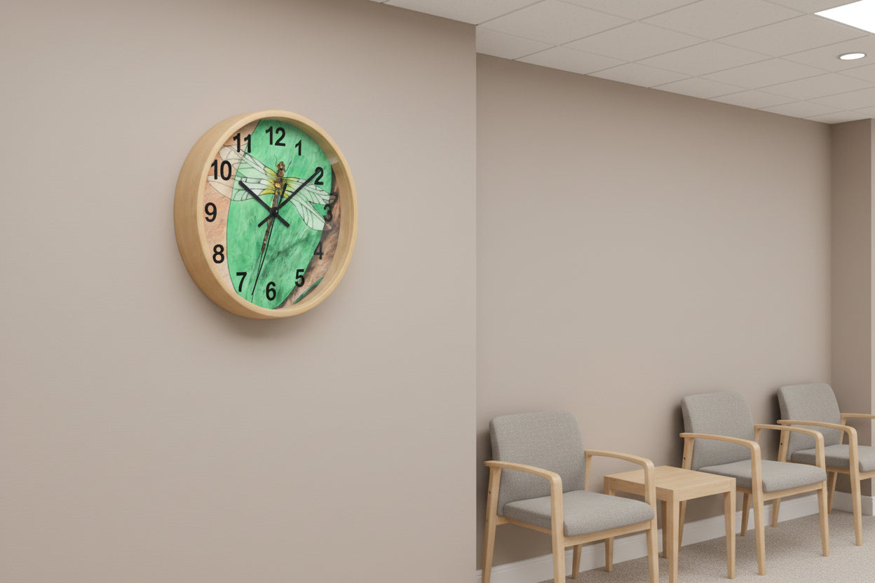 Wall clock with a dragonfly design on a green background