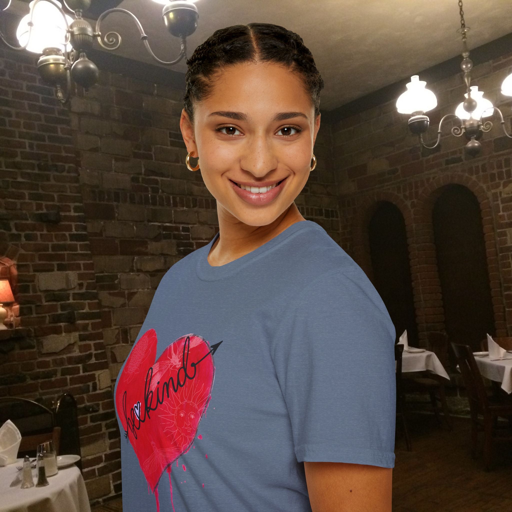 Woman wearing a blue t-shirt with a red heart design in a restaurant setting