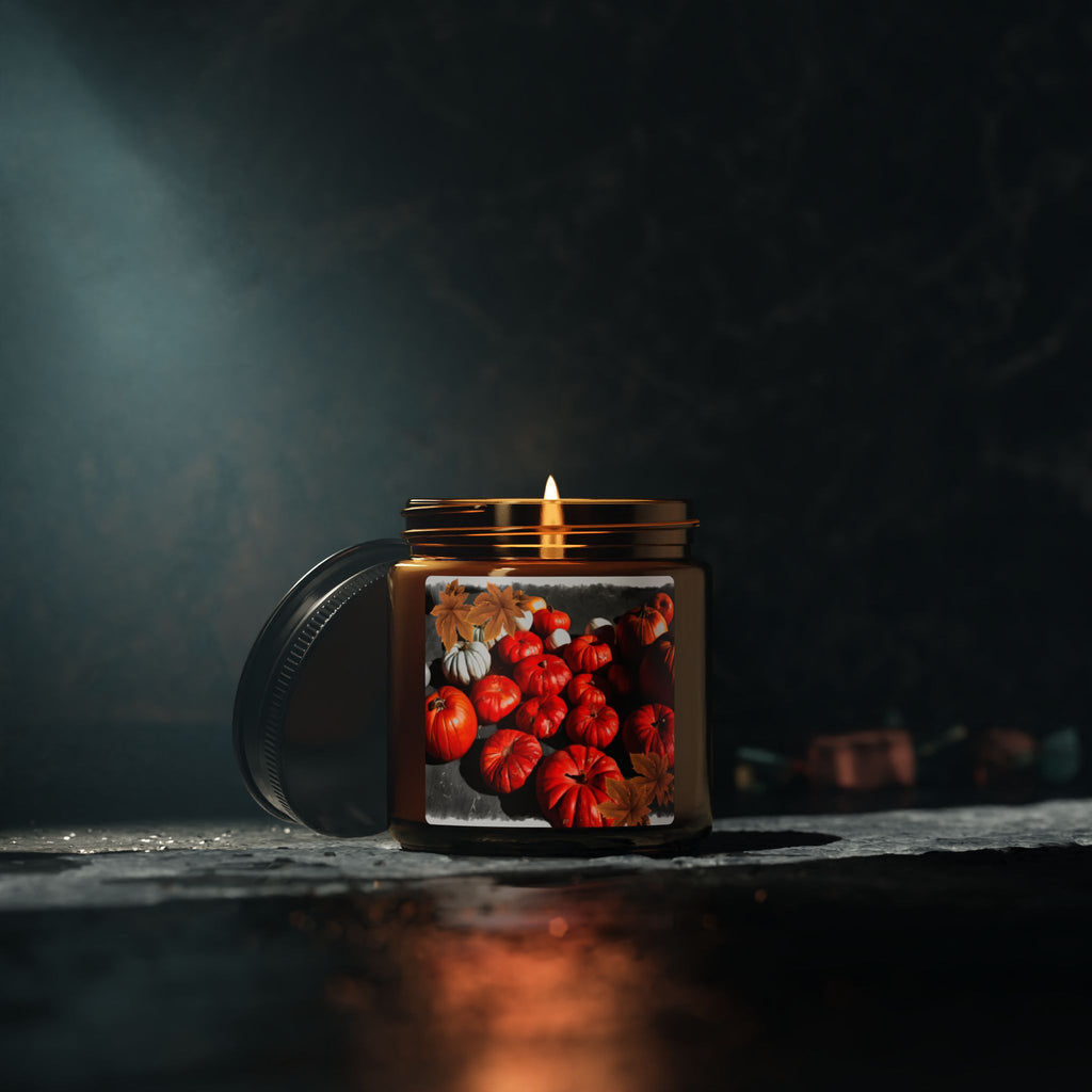 Candle in a jar with pumpkin design on a dark background