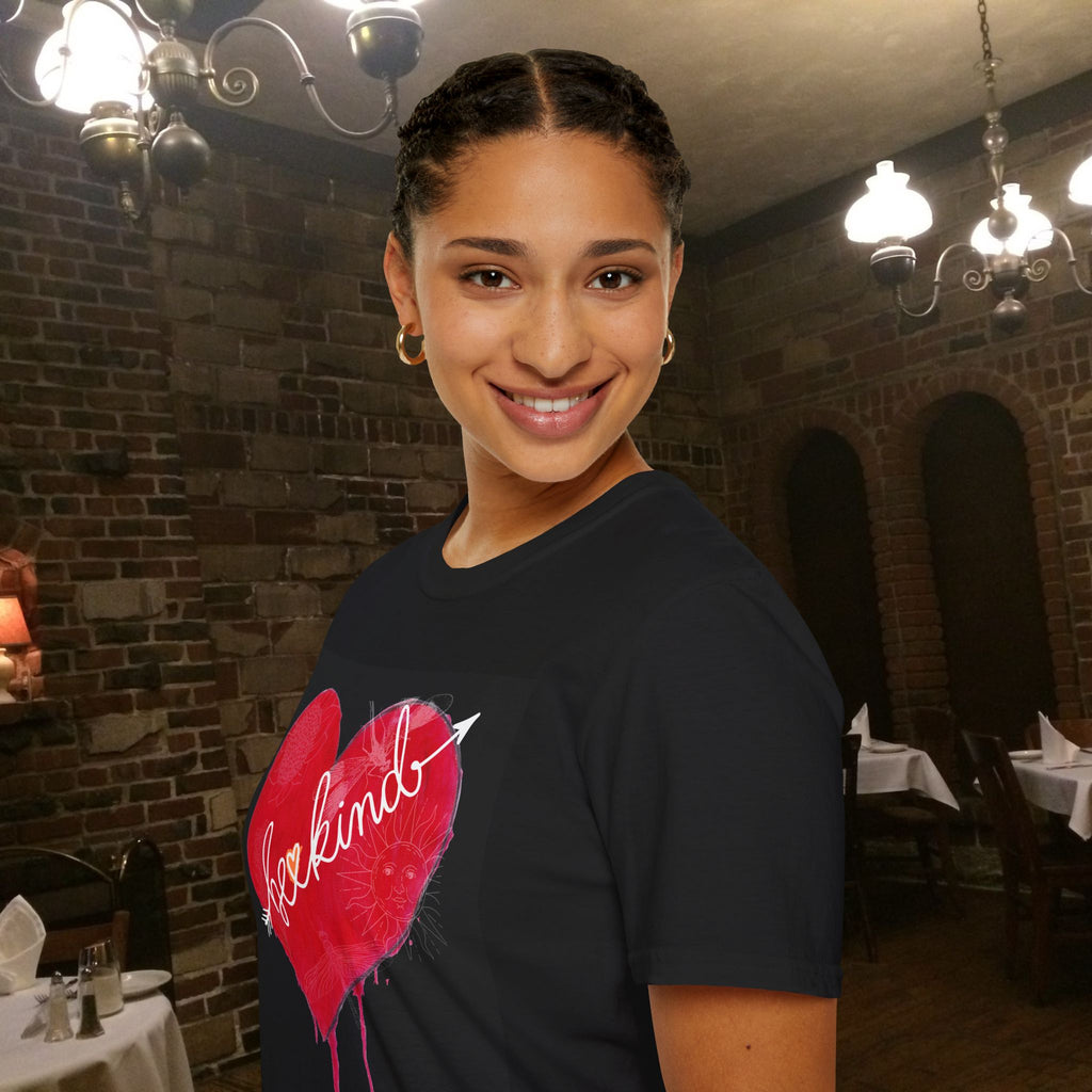 Woman wearing a black t-shirt with a red heart design in a restaurant setting