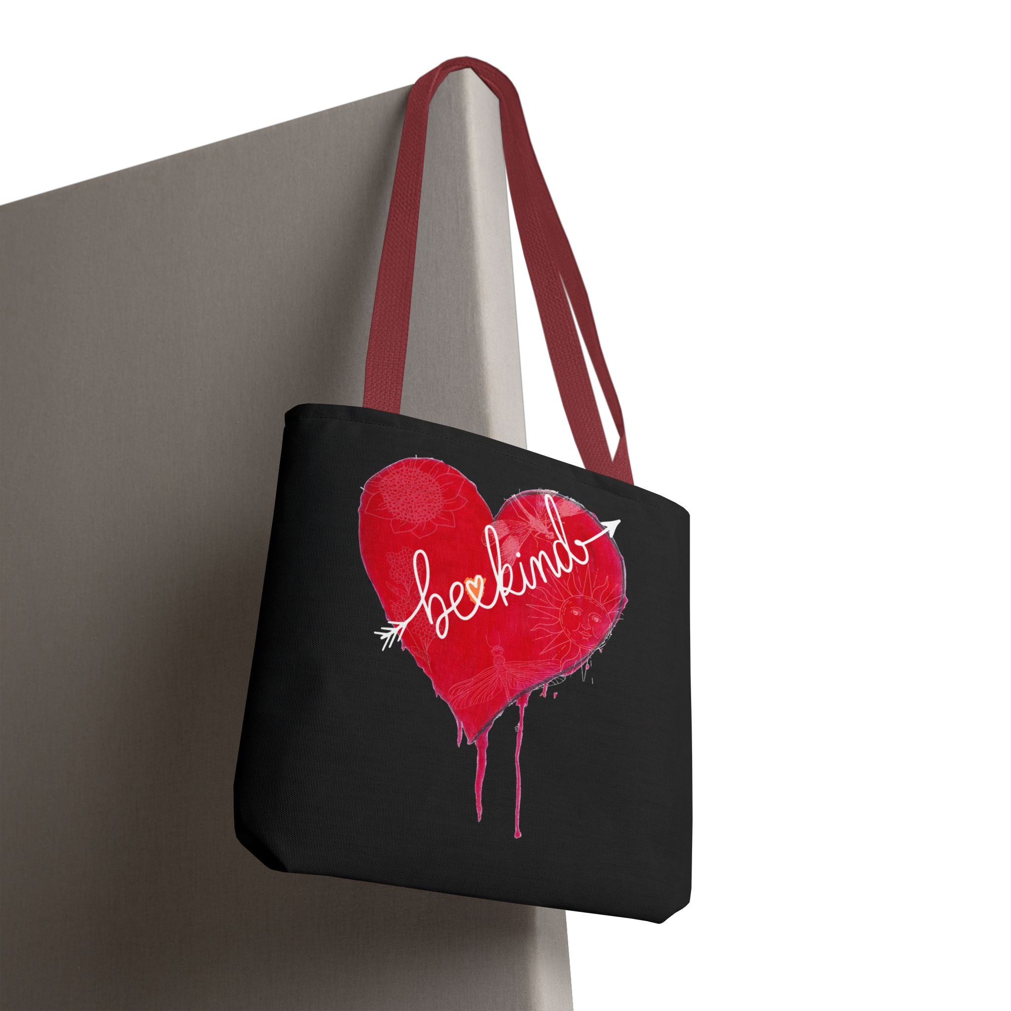 Black tote bag with a red heart and 'love' text on a white background
