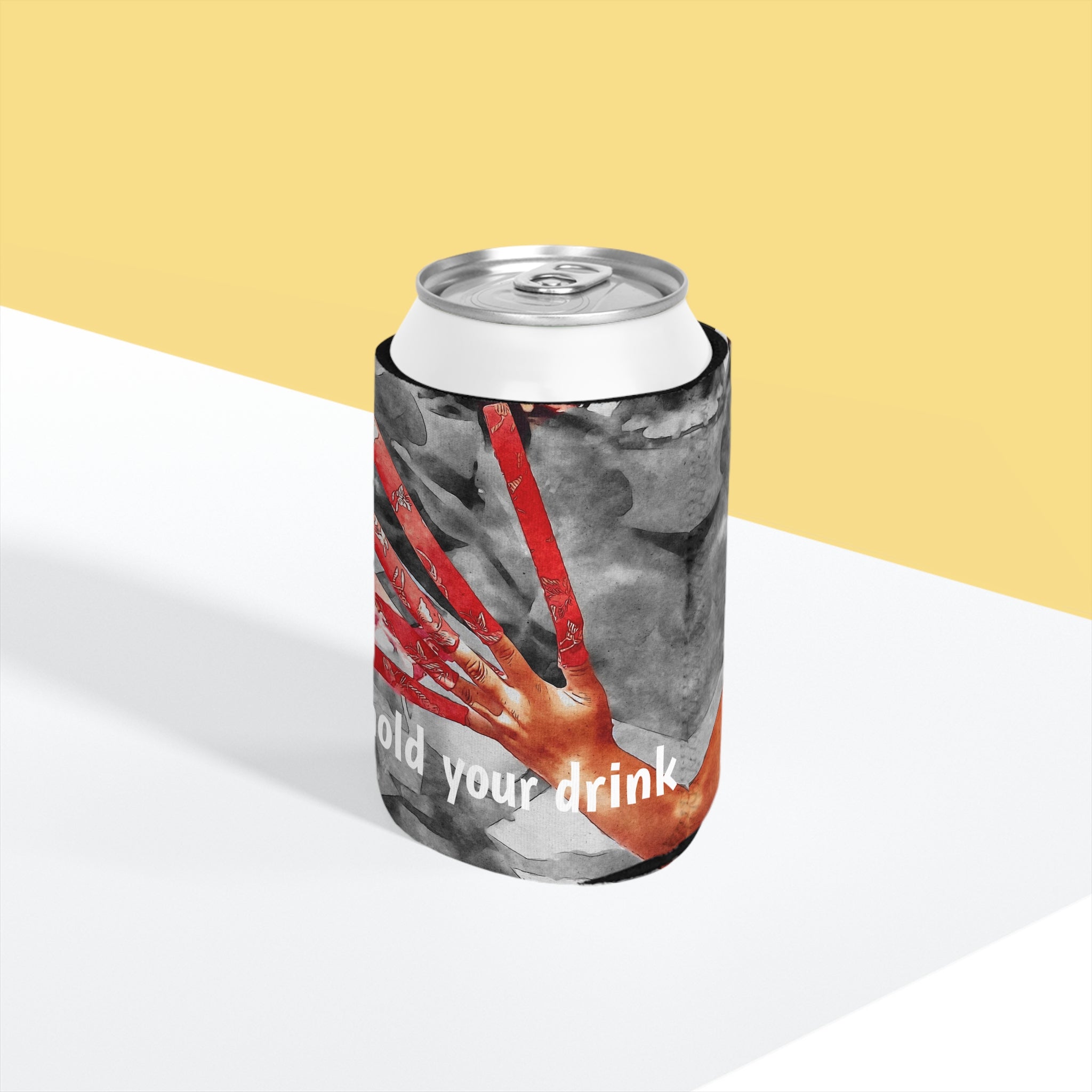 Can cooler with a design of a red shoe and text 'hold your drink' on a yellow and white background