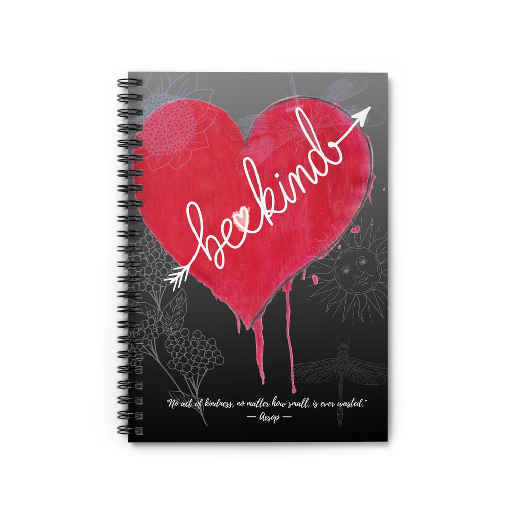 Notebook with a red heart and 'be kind' text on a gray background