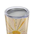 Tumbler with a sun design and text on a white background