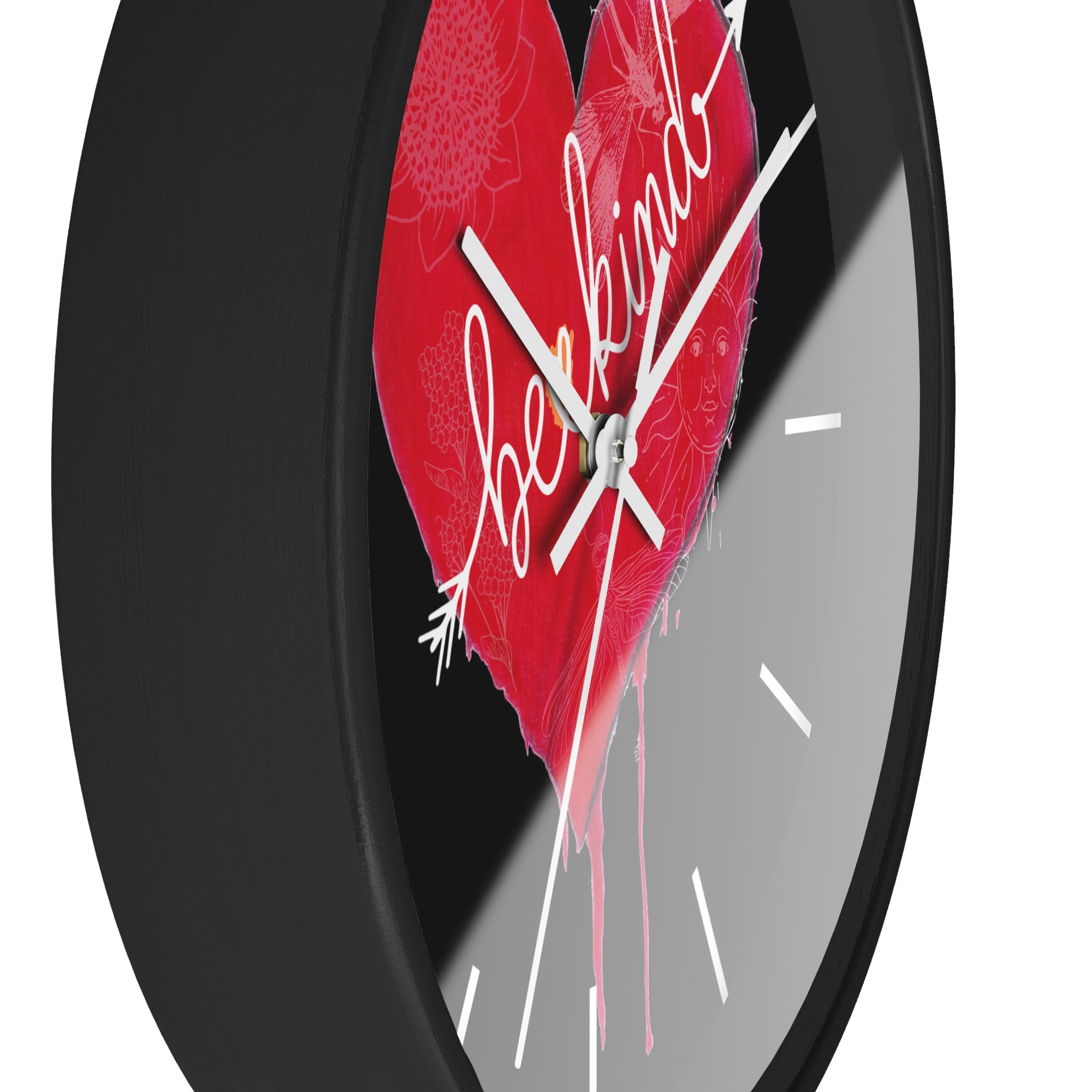 Wall clock with a red heart design and 'be kind' text on a black background