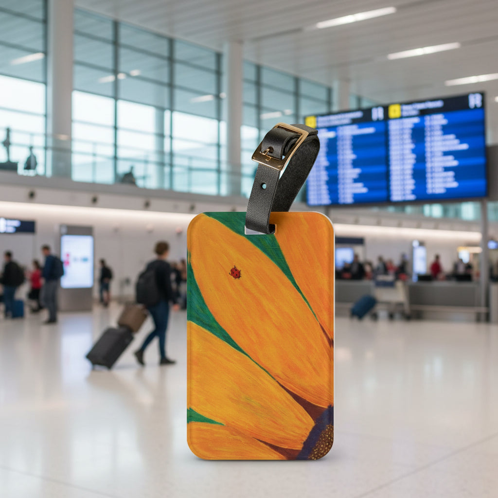 Luggage tag with ladybug on a sunflower design with an airport background