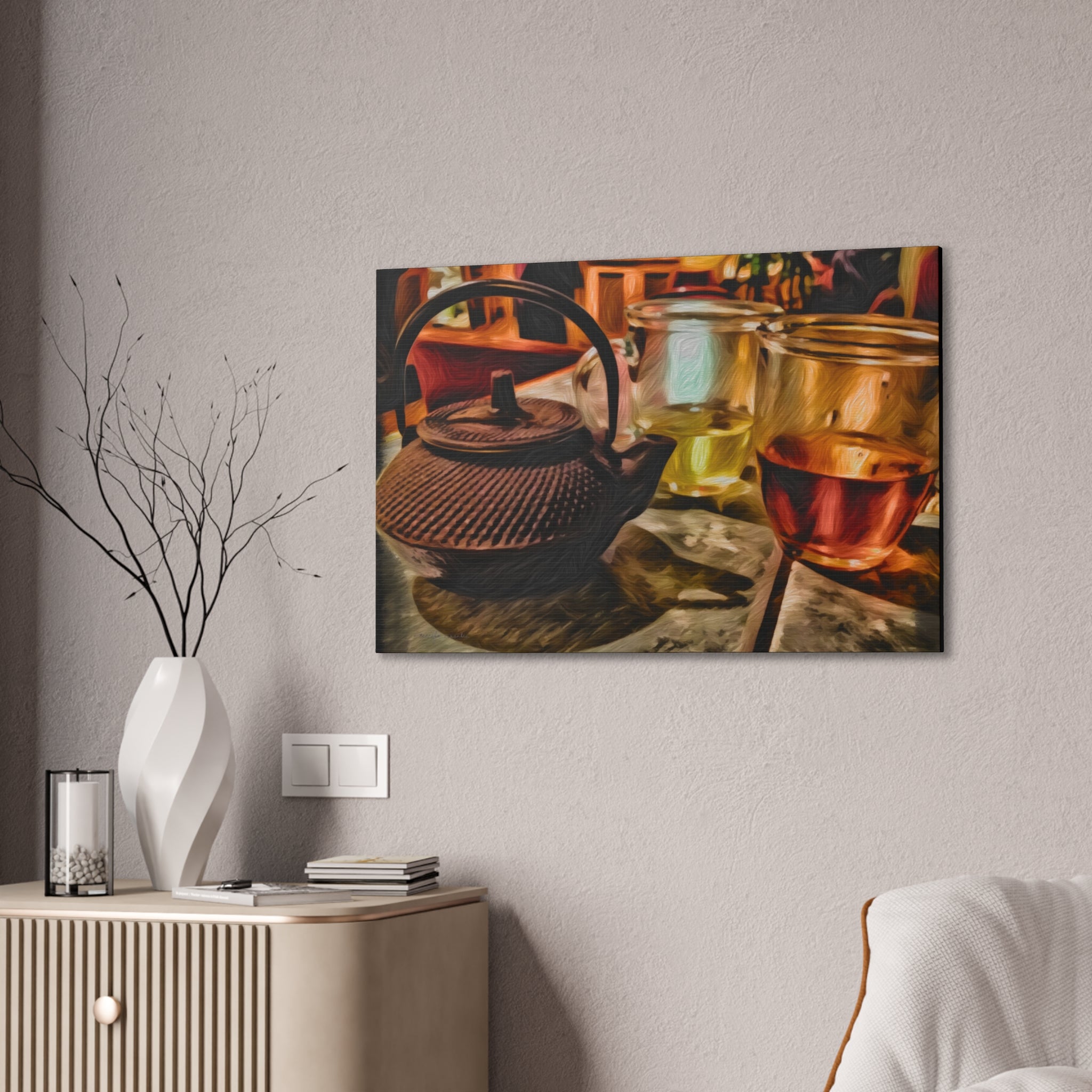 Framed artwork of a teapot and glasses on a wall above a cabinet.