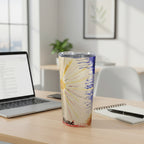 Tumbler with colorful abstract design on an office desk.