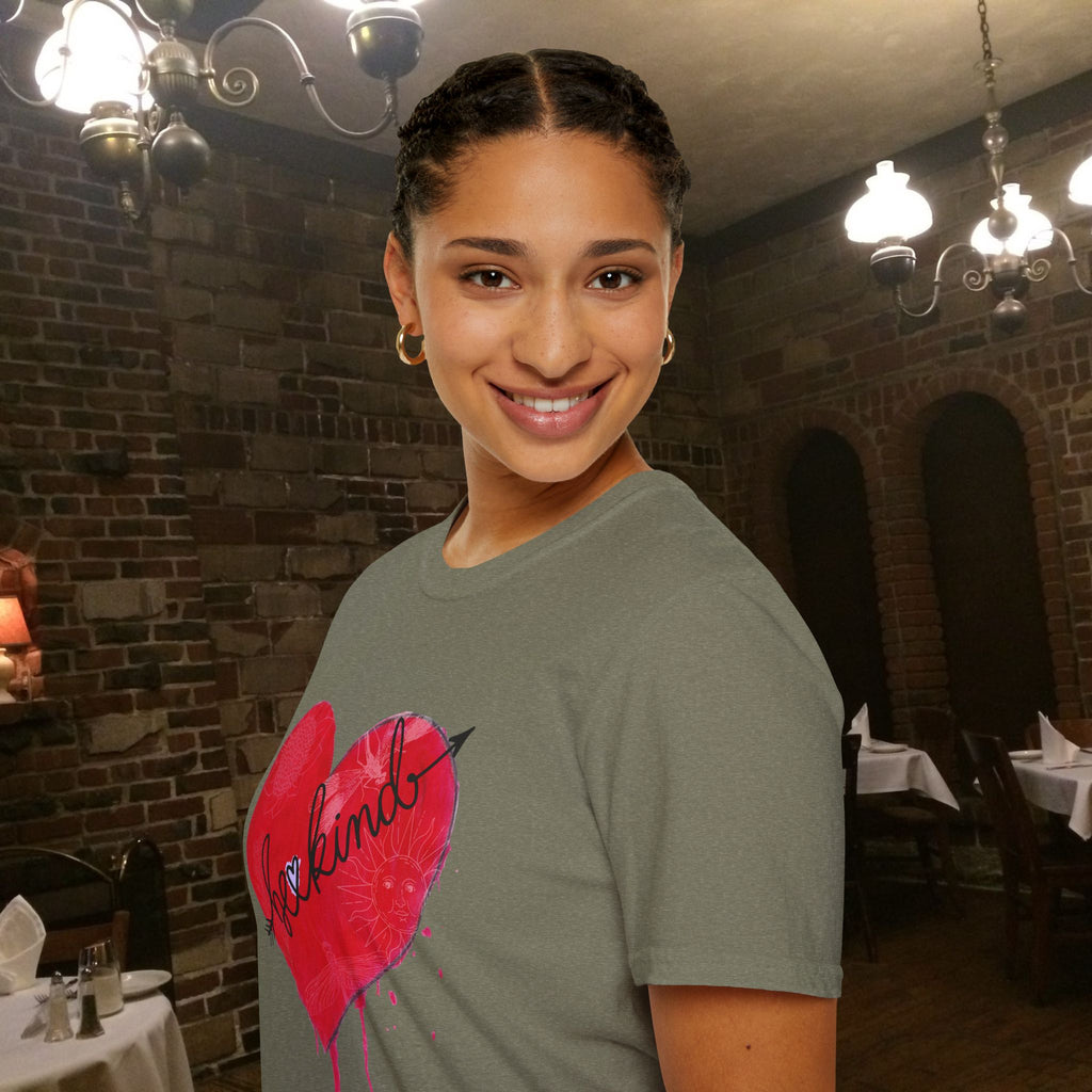 Woman wearing a gray t-shirt with a red heart design in a restaurant setting