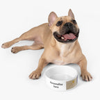 Dog lying next to a customizable pet bowl on a white background