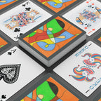 Colorful playing cards with abstract designs on a black surface