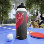 Water bottle with a design on a table tennis table with people playing in the background
