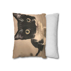 Decorative pillow with a black cat design on a beige background