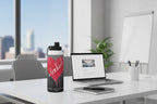 Water bottle with a red heart and 'be kind' text on a gray background