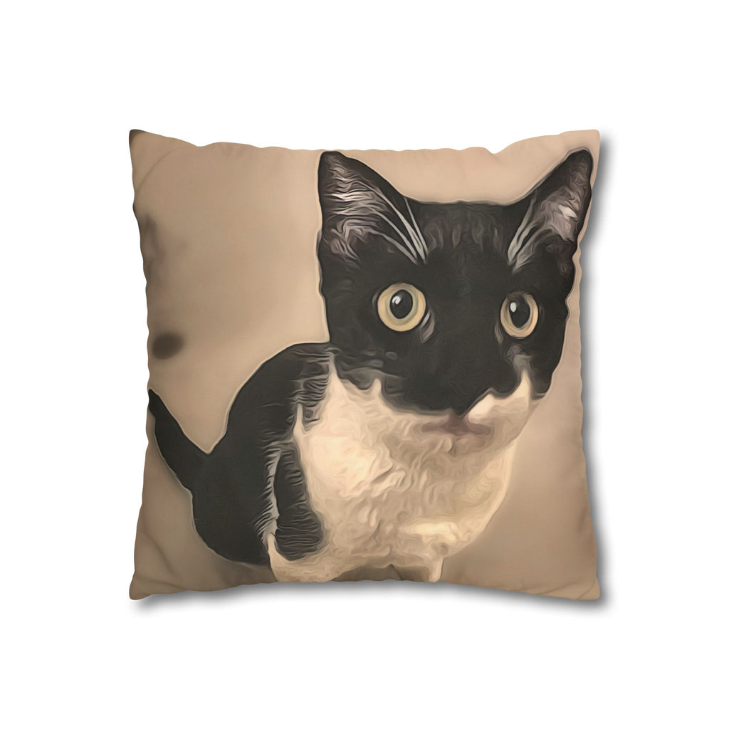 Pillow with a black and white cat design on a beige background