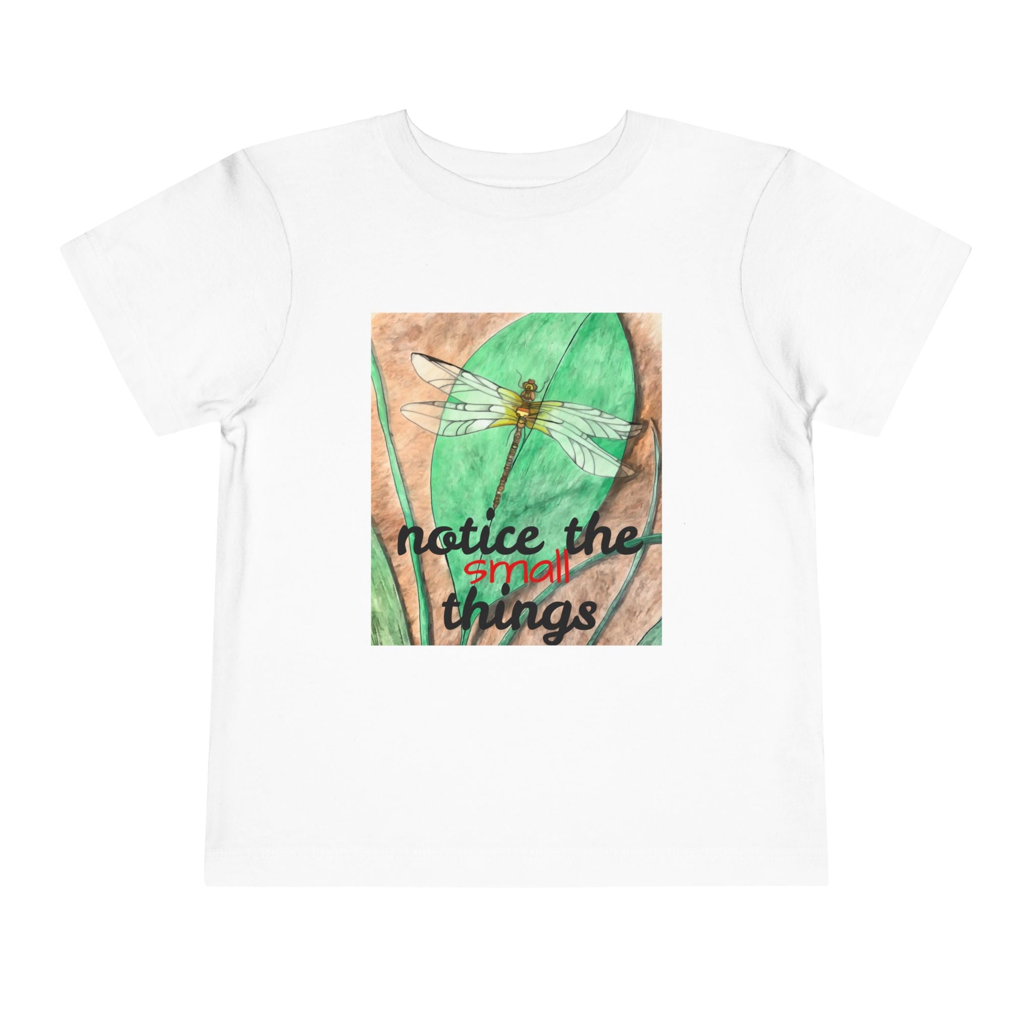 White t-shirt with a graphic of a dragonfly on a leaf and text 'notice the small things' on a white background