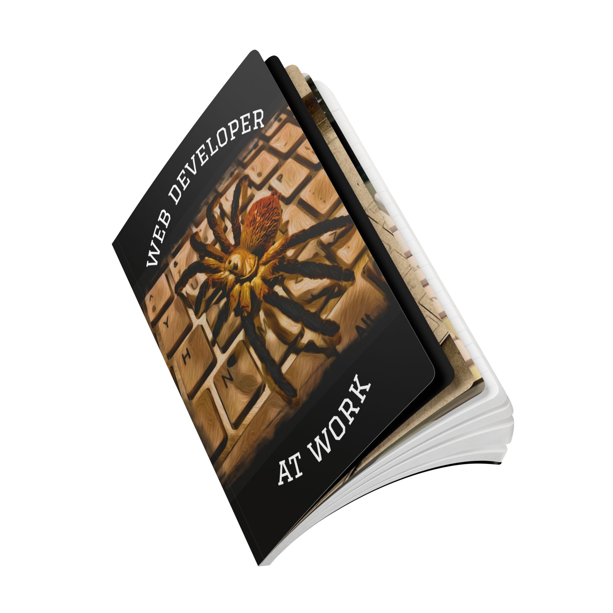 Notebook with a spider illustration and 'Web Developer at Work' text on a white background