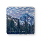 Coaster with a scenic design of Yosemite National Park featuring mountains and trees.