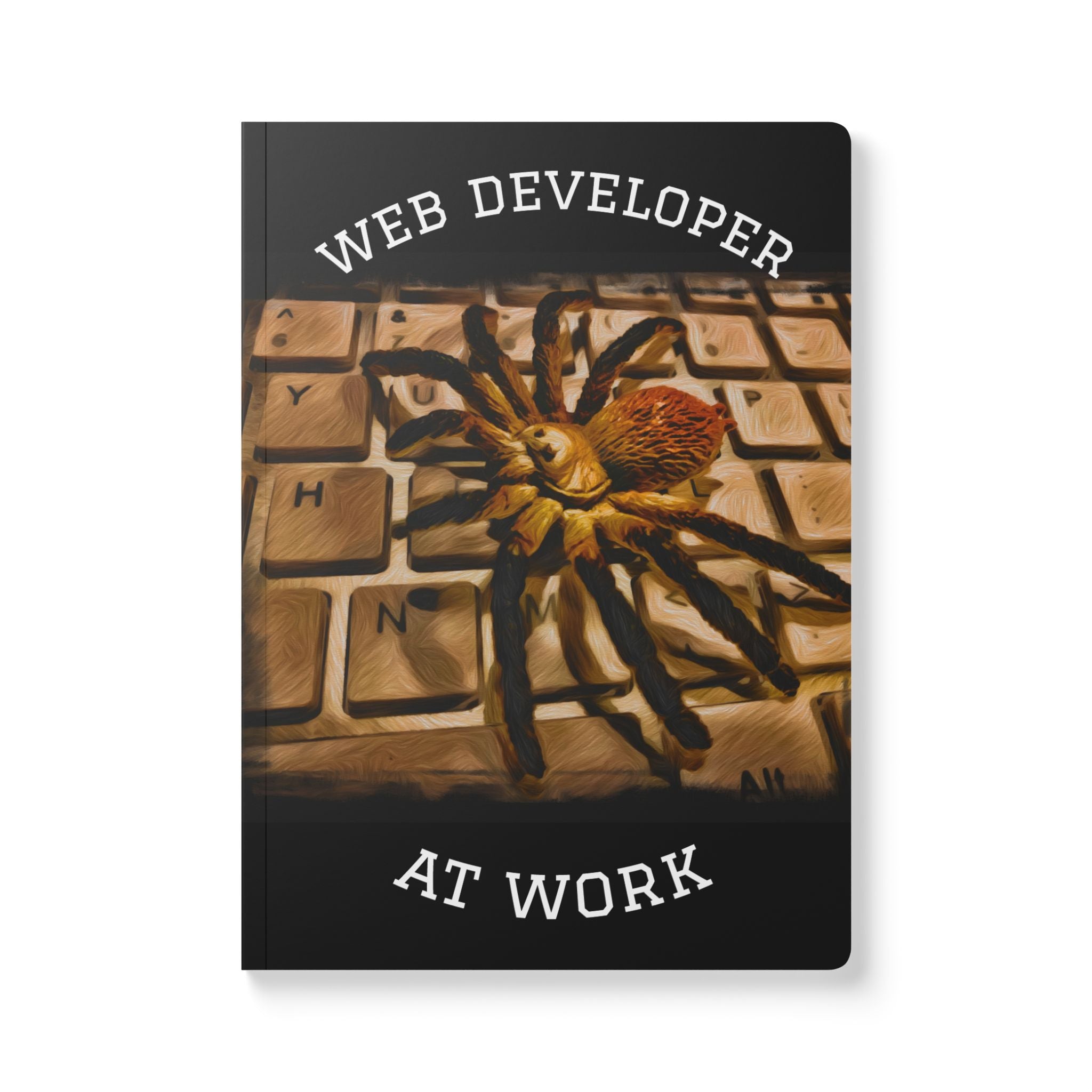 Notebook cover with a spider on a keyboard and text 'Web Developer at Work' on a black background