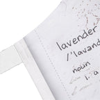 Text on a white fabric label with 'lavender' and its definition.