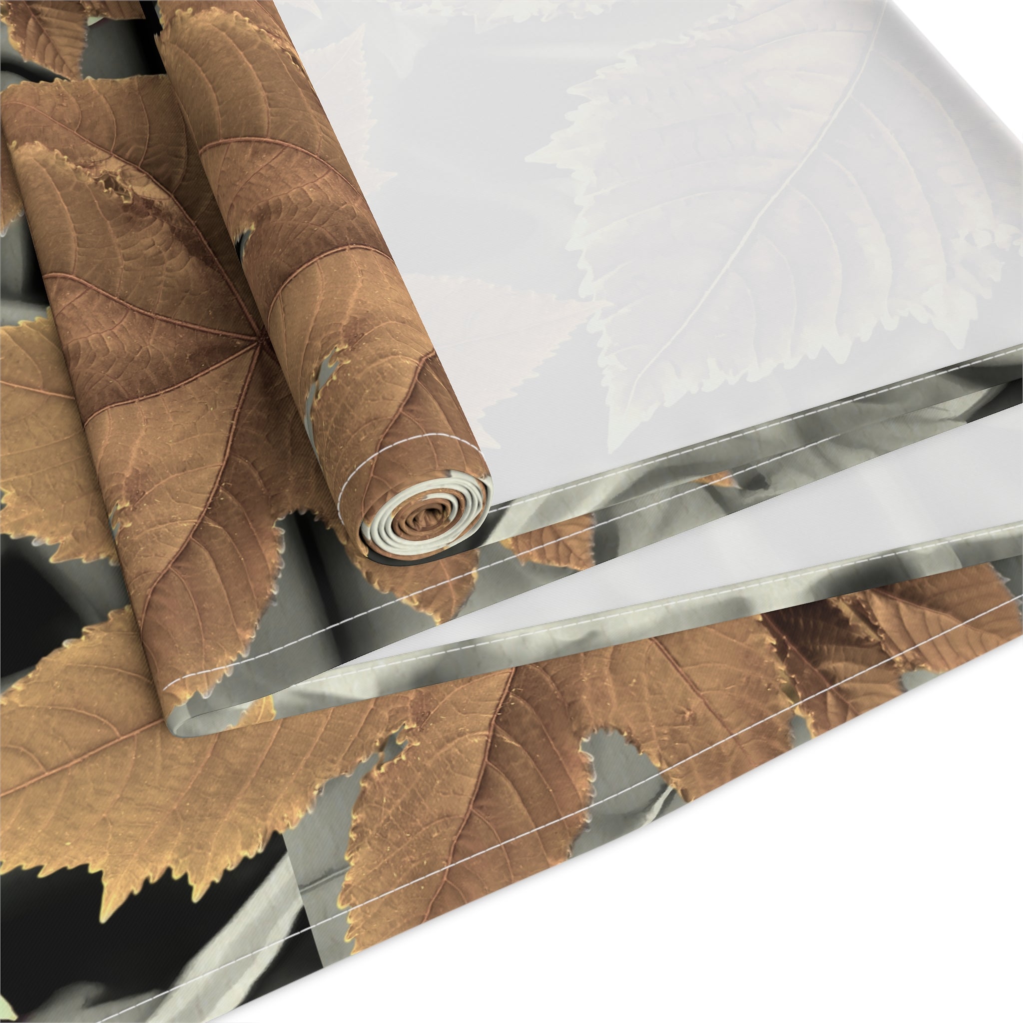 Roll of brown fabric with a clear plastic sheet on a white background