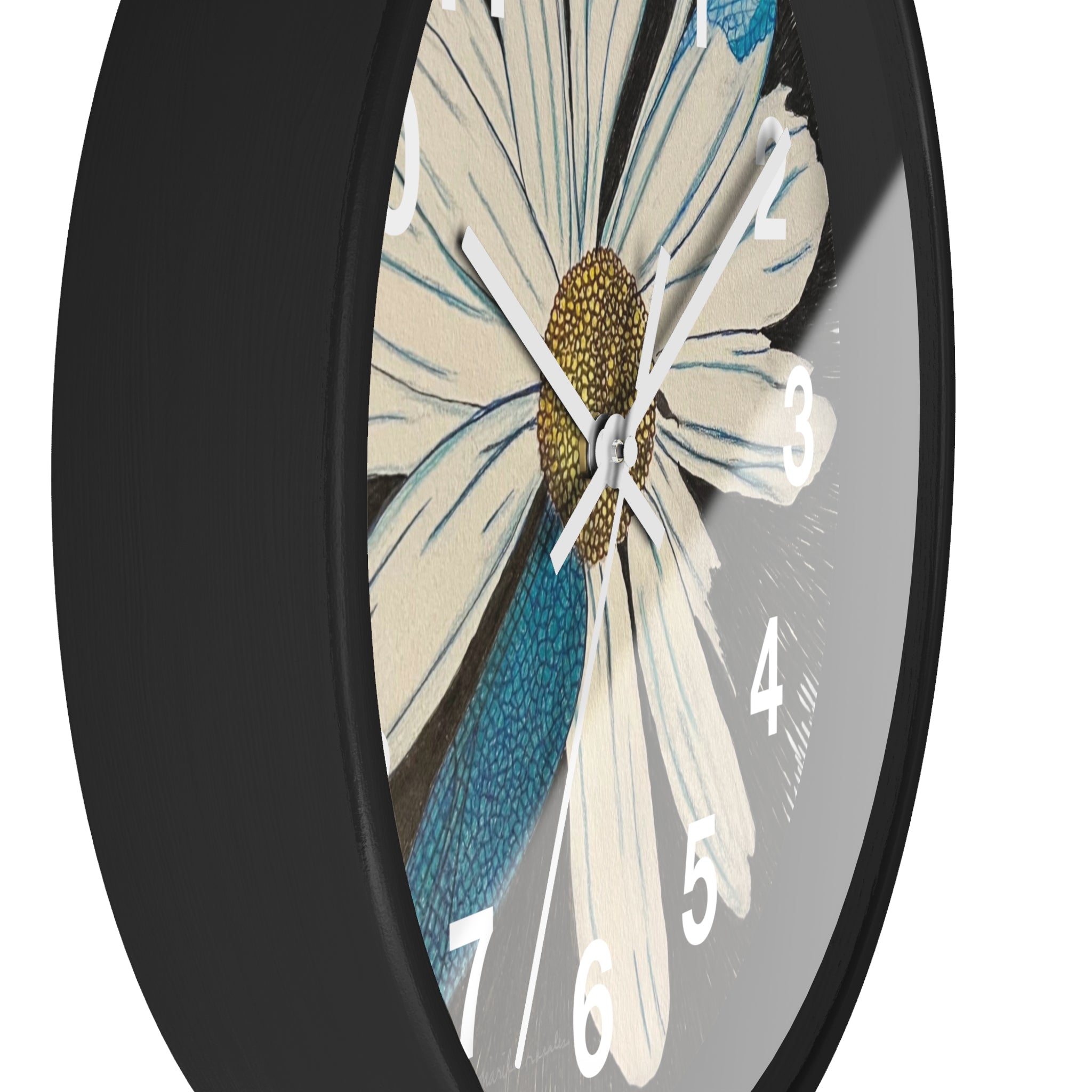 Wall clock with floral design on a black frame