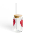 Clear glass tumbler with wooden lid and straw, featuring red heart designs on a white background.