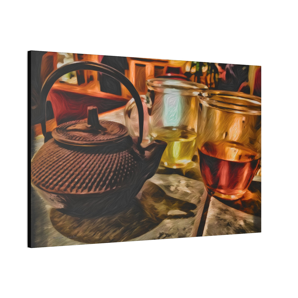 Tea set with a teapot and two glasses on a wooden surface.