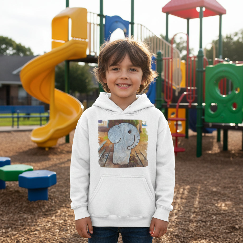 Kic wearing a white hoodie with a graphic design of an elephant at a playground