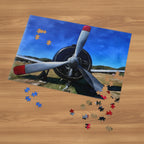 Jigsaw puzzle of Airplane with red tipped propellers on a table