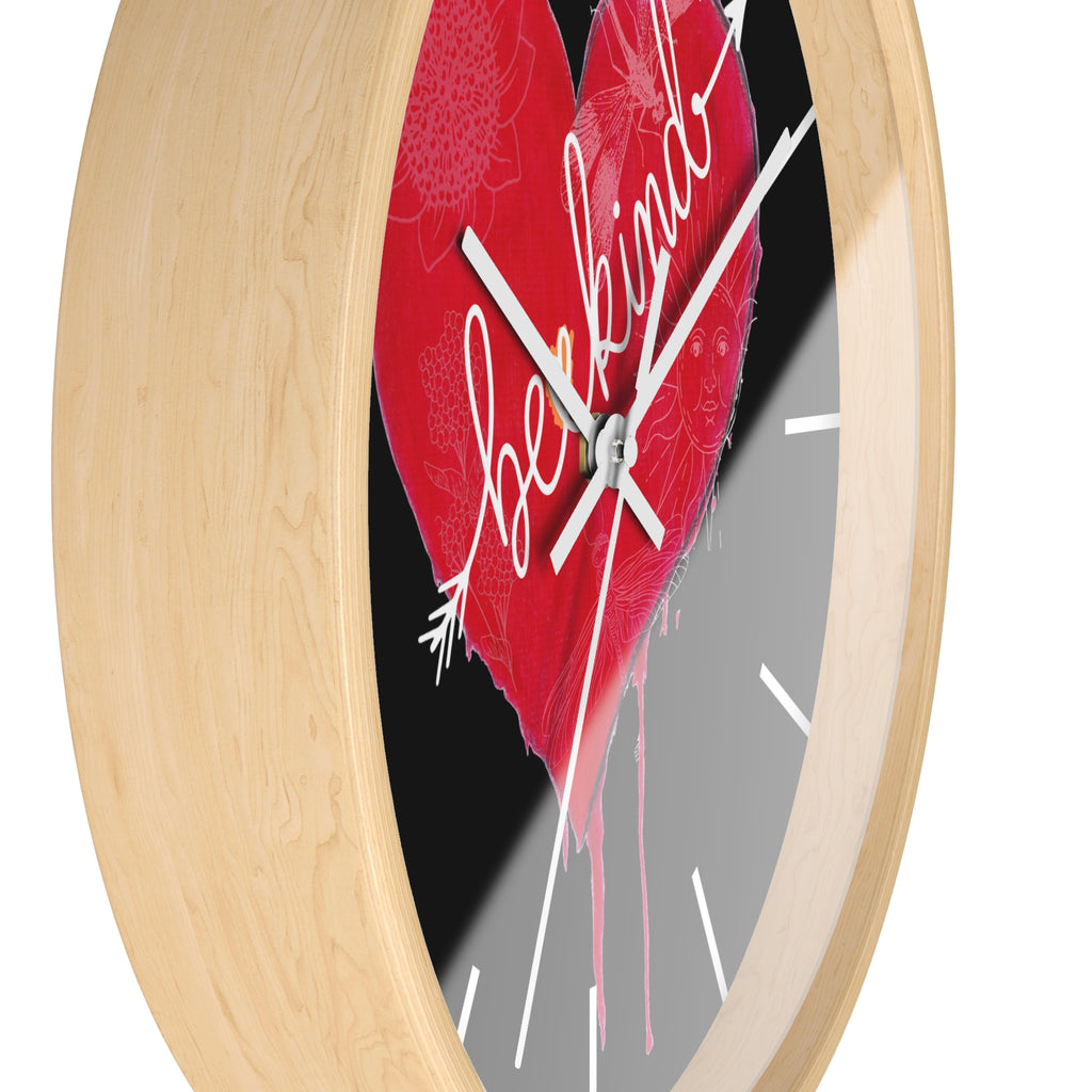 Wall clock with a red heart design and 'Be kind' text on a white background