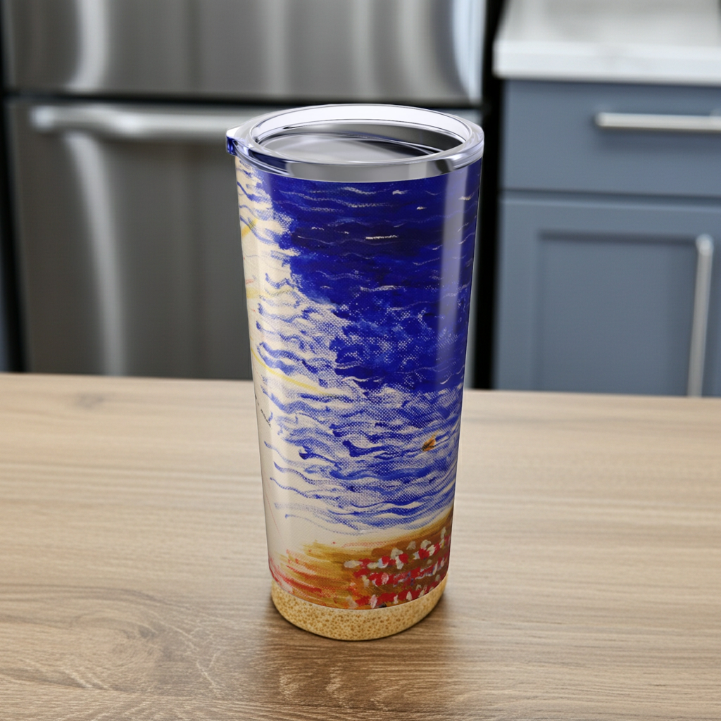 Tumbler with a blue and orange design on a wooden surface