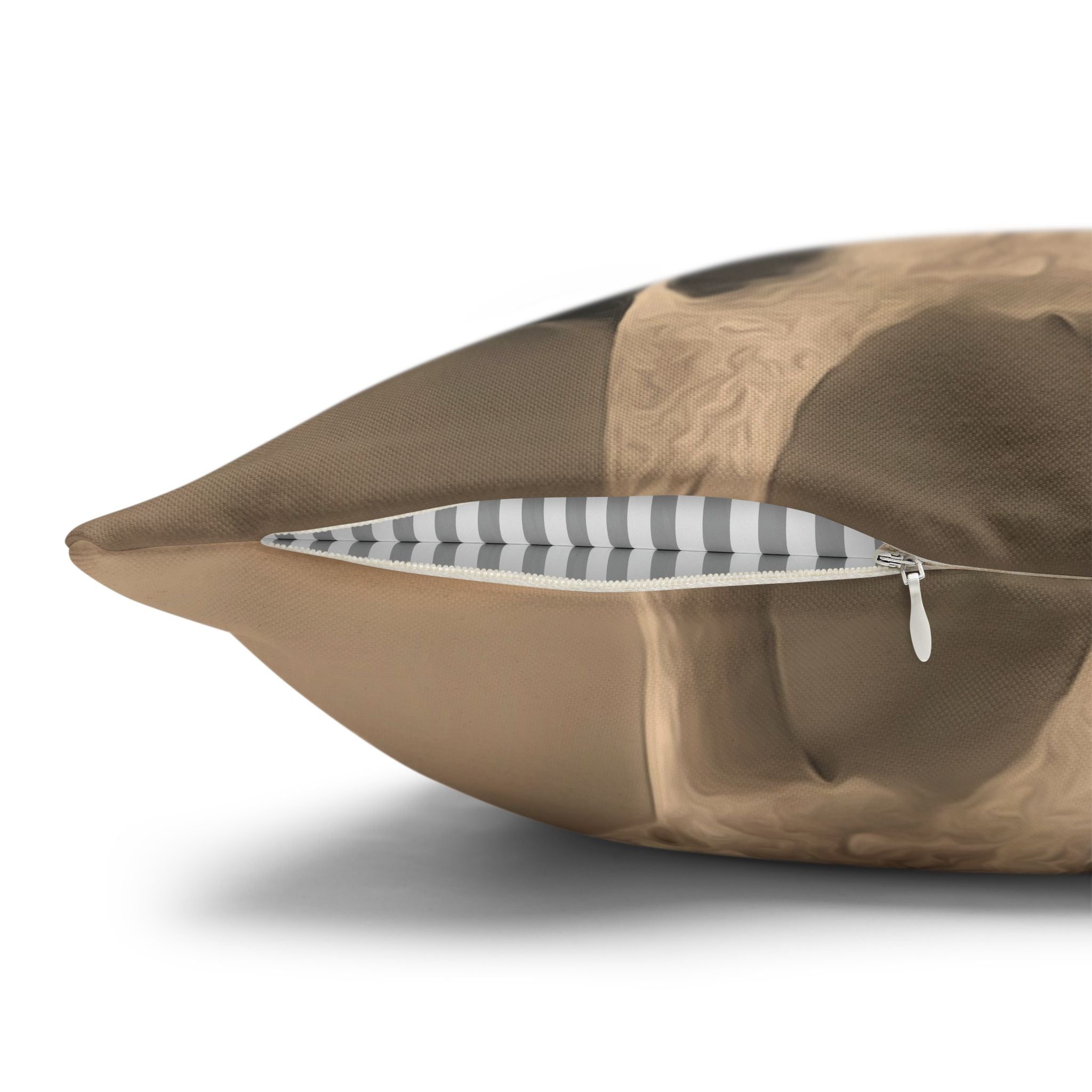 Brown pillow with a zipper on a white background