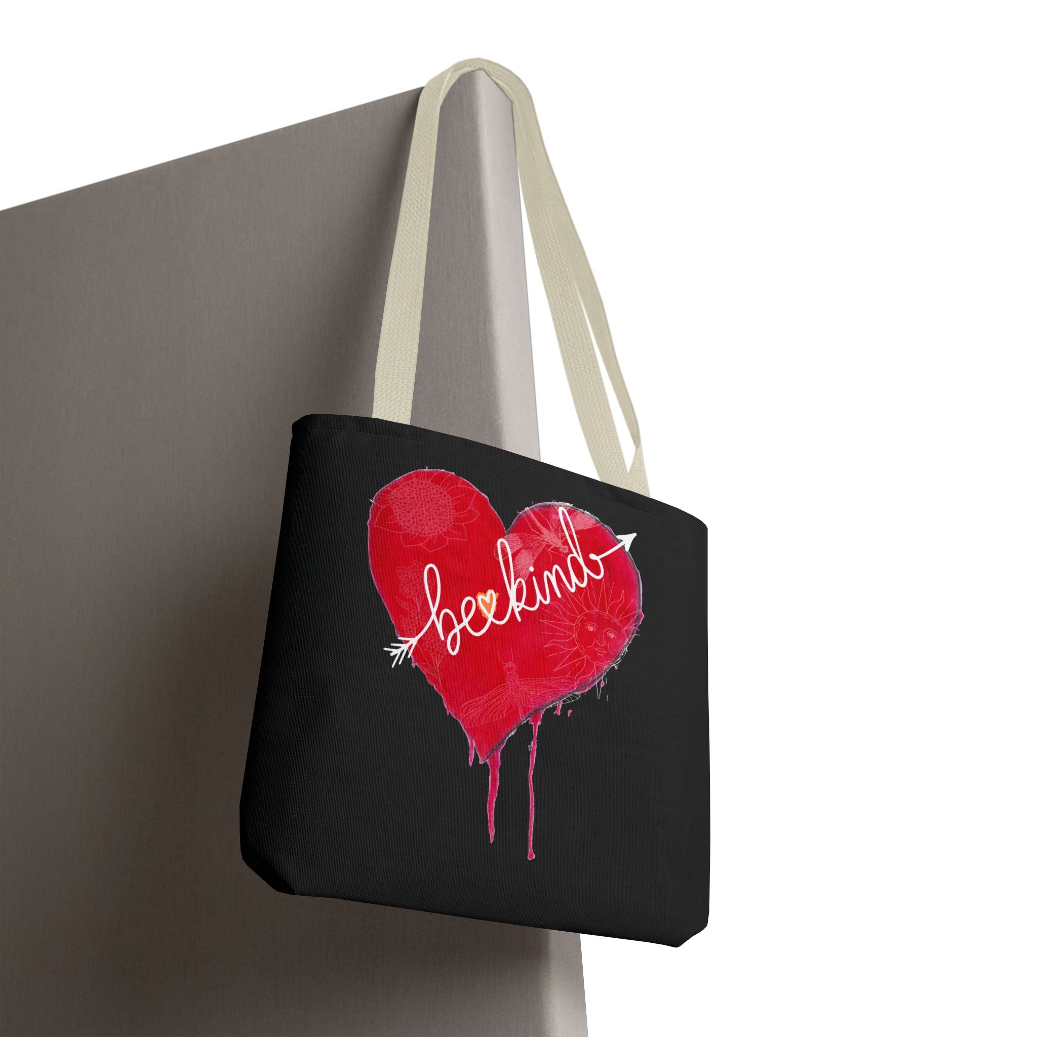 Black tote bag with a red heart and 'love' text on a white background