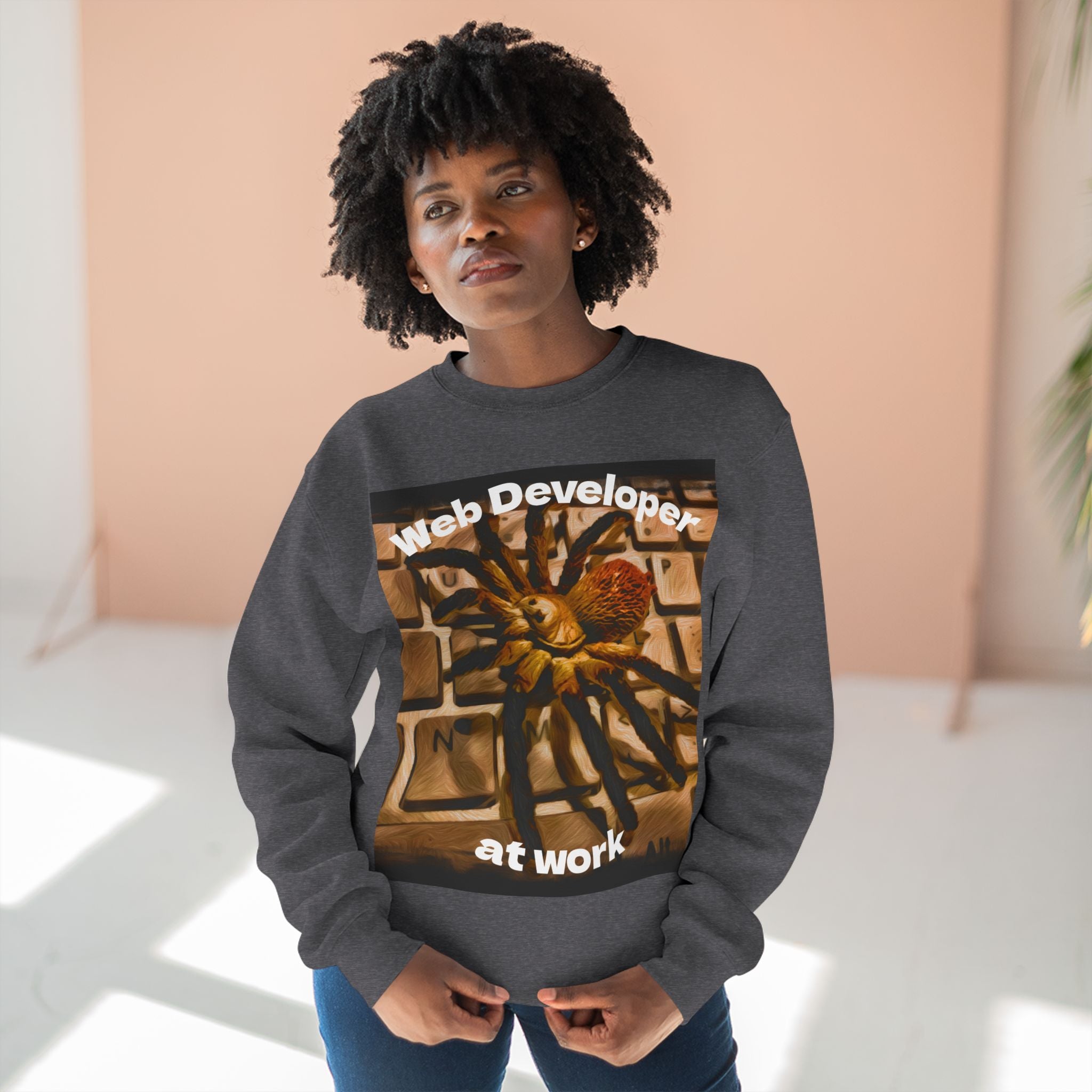 Person wearing a dark gray sweatshirt with a graphic design and text.