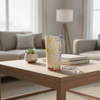 Tumbler with colorful design and 'Here' text on a coffee table