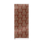 Patterned fabric with tree design on a red background