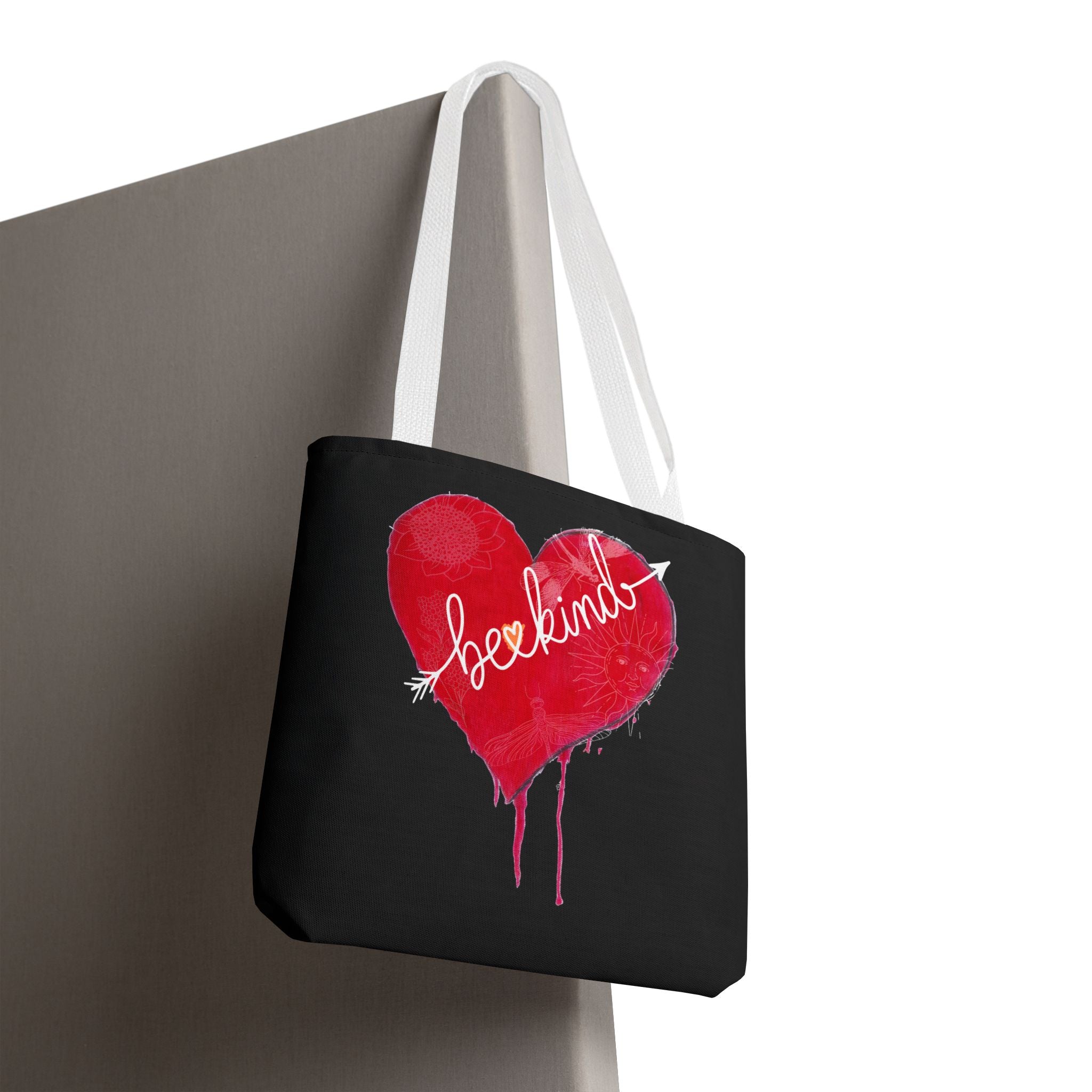 Black tote bag with a red heart and 'love' text on a white background