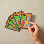 Hand fanning abstract pastel art playing cards against a neutral linen background -- colorful original art poker deck by MyLittleFe.