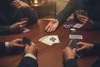 Group playing poker at a dark wood table with chips and abstract pastel art playing cards -- original art deck by MyLittleFe.