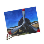 Jigsaw puzzle with airplane propeller design on a blue sky background