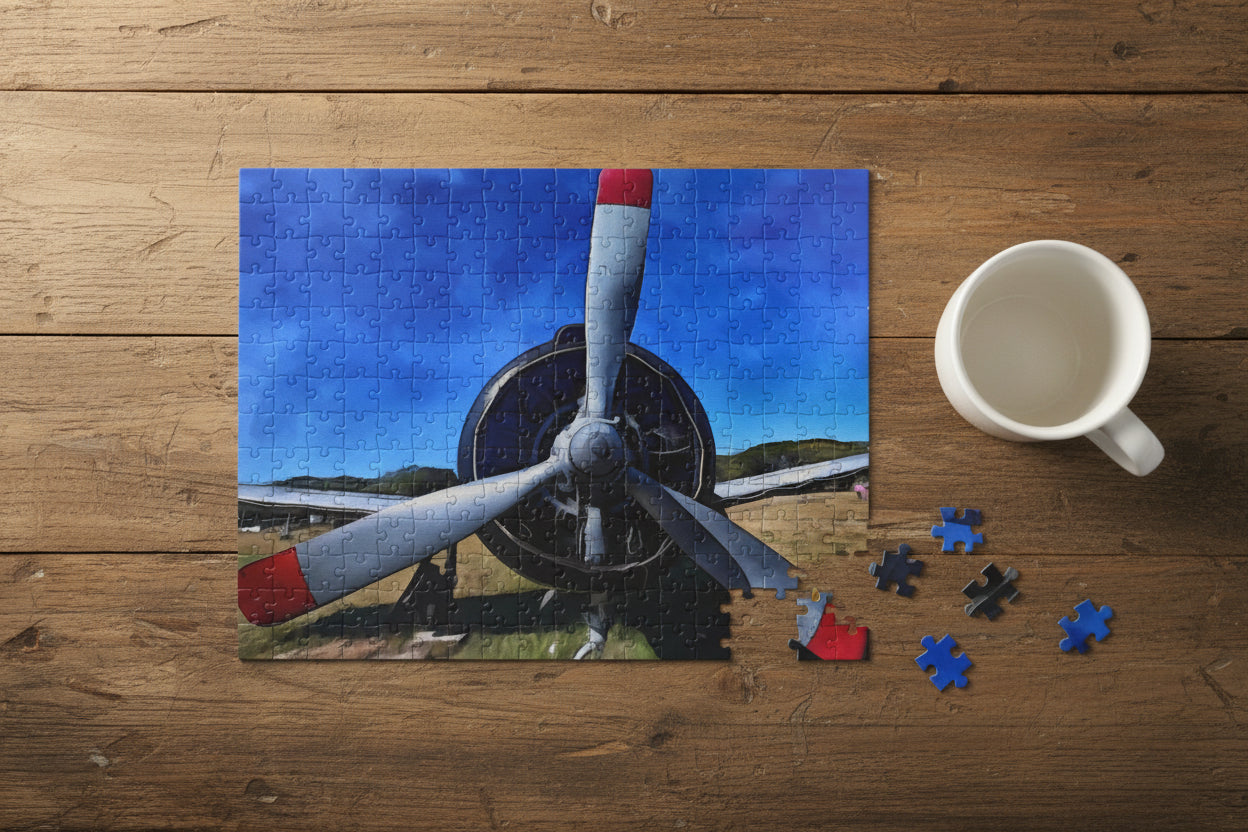 Close-up of an airplane propeller with a scenic background on a rustic table next to a coffee mug